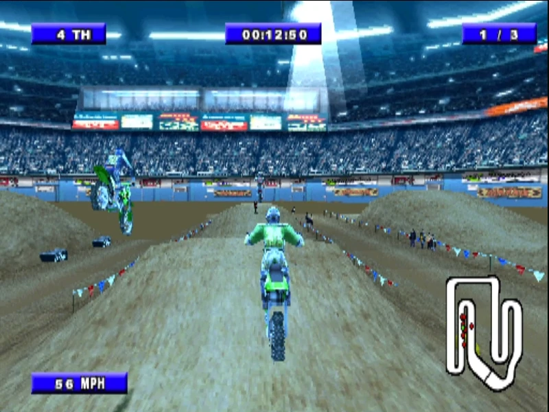 Zawodnik wykonujący efektowny skok na stadionie w Championship Motocross 2001 featuring Ricky Carmichael